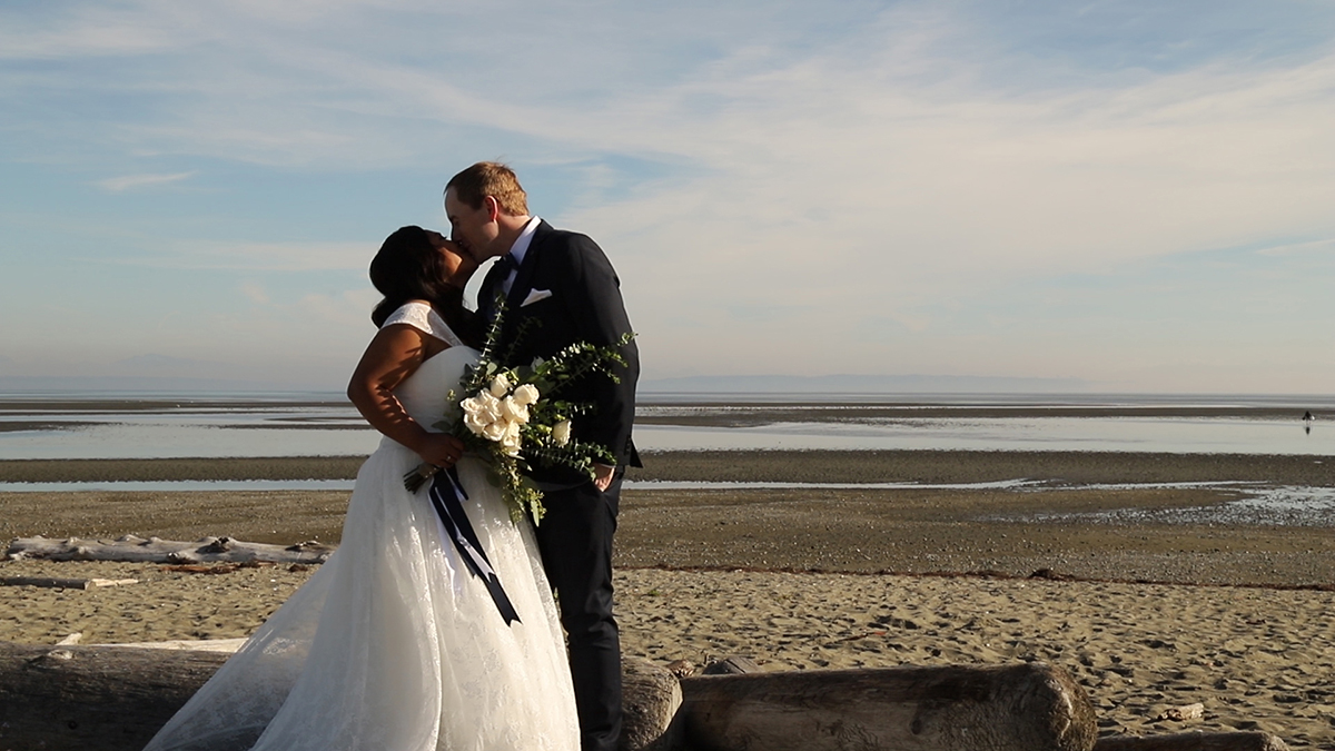 centennial beach wedding portraits-kiss-on-beach 1200 px
